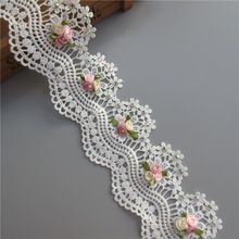 a white lace with pink flowers on it and the price is $ 3 00 each