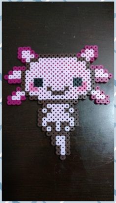 the hello kitty pixel art is made out of perler beads