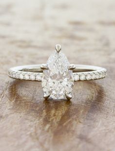 caption:Shown with 1.5ct pear diamond Timeless Pear-shaped Diamond Ring, Classic Pear-shaped Diamond Ring With Accents, Timeless Pear-shaped Diamond Ring With Prong Setting, Gold Pear-shaped Diamond Ring With Accents, Classic Pear-shaped Gia Certified Rings, Timeless Engagement Ring, Pear Cut Engagement Rings, Pear Shaped Ring, Pave Diamond Band