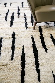 a chair sitting on top of a white rug