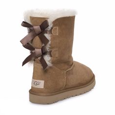 Enjoy The Charm And Comfort Of The Bailey Bow Ii Boot From Ugg. * Twin-Faced Sheepskin Upper With A Suede Heel Guard And Back Lacing For Added Appeal. * The Bailey Bow Ii Is Now Water Resistant And Stain Resistant. * Luxuriously Lined With Uggpure Wool For A Breathable And Warm Environment. * Generously Cushioned Footbed Is Lined In Uggpure Wool. * New Treadlite By Ugg Outsole Provides Increased Traction, Durability, Cushioning And Flexibility. * Slight Dye Transfer May Occur With Darker Colored Brown Sheepskin Boots For Fall, Bailey Bow Uggs Outfit, Luxury Beige Winter Boots, Luxury Sheepskin Round Toe Boots, Brown Uggs, Luxury Brown Shearling Boots, Ugh Boots, Brown Ugg Boots, Uggs With Bows