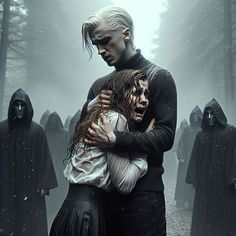 two people hugging each other in the middle of a foggy forest with hooded figures behind them