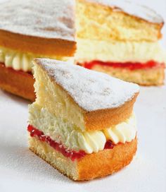 two pieces of cake sitting on top of a white table