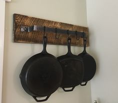 pots and pans are hanging on the wall