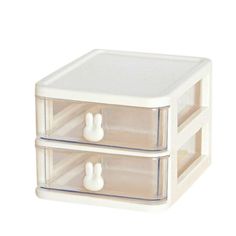 two drawers with bunny ears on the top and one drawer open to show something inside