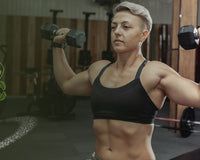 a woman is working out in the gym