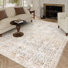 a living room filled with furniture and a large rug on top of a hard wood floor