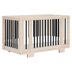 a wooden crib with black and white stripes on the sides, against a white background