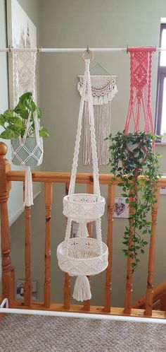 three macrame hangings on the banister