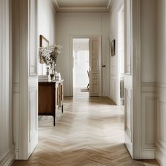 The hardwood floors in this Scandinavian hallway are a long-lasting and cost-effective flooring option, as they can be sanded and refinished if scratches or dents occur Entrance Way