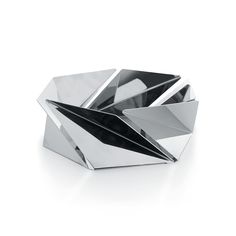 a metal object sitting on top of a white surface