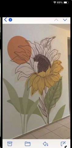 an image of a sunflower painted on the wall