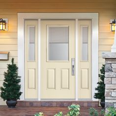 a front door with two potted plants on the side