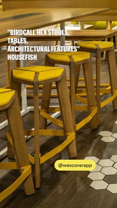 three wooden stools sitting next to each other on top of a hard wood floor