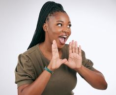 a woman making a funny face with her hands