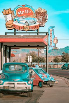 an old car parked in front of a diner