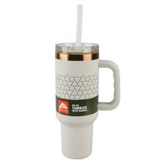 a white coffee cup with a straw in it