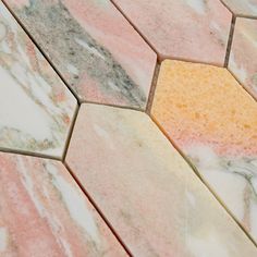 an orange and pink marble pattern on the floor