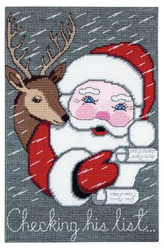 a cross stitch christmas card with santa claus holding a deer's head and the words, checking his list