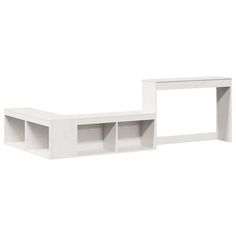 two white bookshelves sitting next to each other on top of a wall mounted shelf