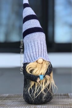 a stuffed animal wearing a knitted hat