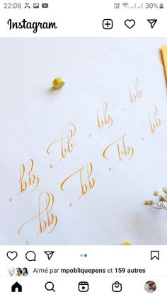 an instagram page with gold lettering on white paper and yellow pencils next to it