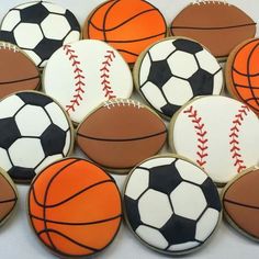 decorated cookies with sports balls on them are ready to be eaten for the next game