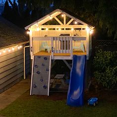 a backyard with a slide and lights on the roof