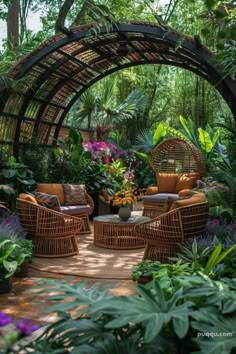 an outdoor living area with wicker furniture and plants