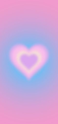 a blurry image of a heart on a pink and blue background