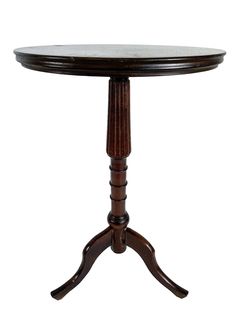 a wooden table with a marble top on an oval base and two small legs at the bottom