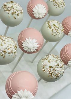 cake pops with white flowers and gold sprinkles