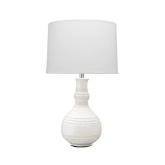 a white table lamp with a white shade on the base and a white fabric lampshade