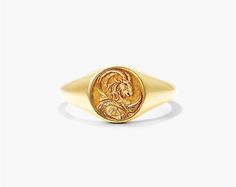 14K Yellow Gold Capricorn Zodiac Signet Ring. Capricorn is symbolized by the sea goat which represents the marriage between the mind and the soul. The goat embodies the steadiness, ambition and intelligence, while the fish tail represents passion, intuition and connection. Inspired by mythological imagery, our Zodiac Signet Ring collection is the perfect talisman to channel this energy. Capricorn Ring, Sea Goat, Dress Reference, Golden Goddess, Capricorn Zodiac, Effortlessly Chic Outfits, Fish Tail, Zodiac Capricorn, Ring Collection