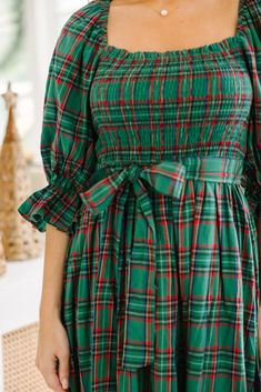 All I want for you is to be able to check out this adorable midi dress! It's so feminine and that tartan plaid print is absolutely perfect for the holiday season! This midi dress is going to look so good with heels or booties for any holiday party! Square neckline Smocked bust 3/4 sleeves with elastic cuffs Tied sash waist Plaid print No stretch however the smocking extends the bust *Plaid Colors: green, blue, red, yellow, white. Baileigh is wearing the small. Green Tartan Dress, Plaid Christmas Dress, Trendy Christmas Outfits, Green Tartan, Tartan Dress, Colors Green, Model Fits, All I Want, Plaid Print