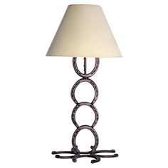 a table lamp with a white shade on it