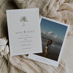 an image of a couple on the beach with their wedding photos taken in front of them