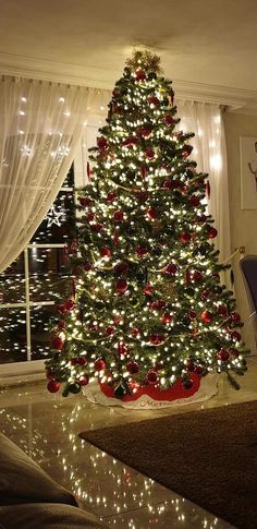 a decorated christmas tree in a living room