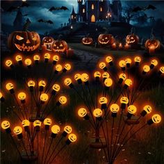 many pumpkins are lit up in front of a castle