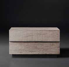 a wooden box sitting on top of a black surface