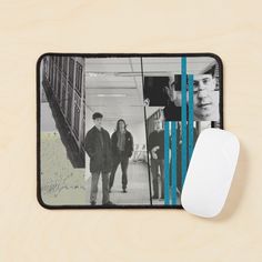 a mouse pad with an image of two men and a woman walking down a hallway