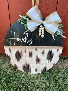 a wooden sign with the word holly painted on it