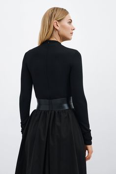 Our Ophelia Belt is a match made for all the garments in your closet. Handcrafted from luxe Italian leather, geometric seam details sculpt the form of the belt and add shape to the waistline. Ophelia's contrast zipper front-and-center makes for eye-catching edge, while an understated elastic panel at the back provides a comfortable stretch fit. Add Ophelia to your dresses, jumpsuits, tunics and beyond...you'll find so many ways to style her. | Maritza Large Belt Outfit, Belt Outfit, Large Belt, Social Impact, Work Week, The A Team, Black Belt, Italian Leather, Tunics