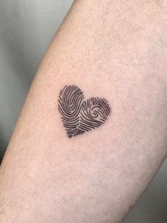 a fingerprint in the shape of a heart is shown on someone's leg