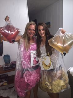 two women in plastic bags posing for the camera