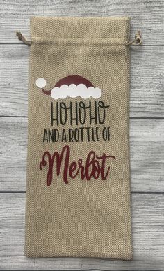 a bag with the words hohoo and a bottle of merot on it