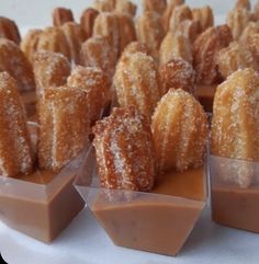 several desserts are arranged in small trays on a table