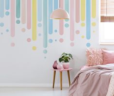 a bed room with a neatly made bed and a colorful wall mural on the wall