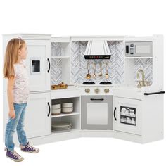 L-SHAPE DESIGN: A convenient construction allows this playset to fit comfortably in the corner of any room, so your child can engage in hours of kitchen adventures! AMPLE STORAGE: Open storage in the fridge, pantry, oven, and sink shelves provide ample space for your child's favorite play accessories from other kitchen sets or stuffies to enjoy their cooking TRUE-TO-LIFE KITCHEN: This includes a built-in play microwave and oven with clicking knobs, a light-up hood that mimics authentic sounds, a Pantry Oven, Kitchen Playsets, Fridge Pantry, Play Corner, Kids Play Set, Corner Kitchen, Play Kitchens, Sink Shelf, Pretend Play Kitchen