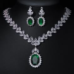 Experience the epitome of elegance with our Luxury Emerald Bridal Jewelry Sets. These exquisite pieces feature captivating green emerald-like stones crafted from AAA Cubic Zirconia, meticulously set in a pendant necklace and coordinating earrings. Designed to enhance your allure at any special occasion, from weddings to glamorous parties and elegant dinner events, these sets embody a timeless sophistication. Style: TRENDY Shape\pattern: Geometric Occasion: Wedding Metals Type: Copper Alloy Mater Emerald Jewelry Aesthetic, Emerald Bridal Jewelry, Emerald Green Jewelry Set, Green Jewellery Set, Emerald Jewelry Necklace, Emerald Necklace Set, Emerald Jewelry Set, Green Emerald Necklace, Emerald Green Jewelry